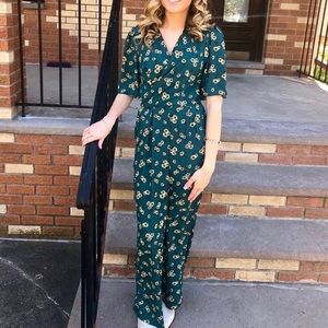 Francesca’s daisy flower, green jumpsuit.